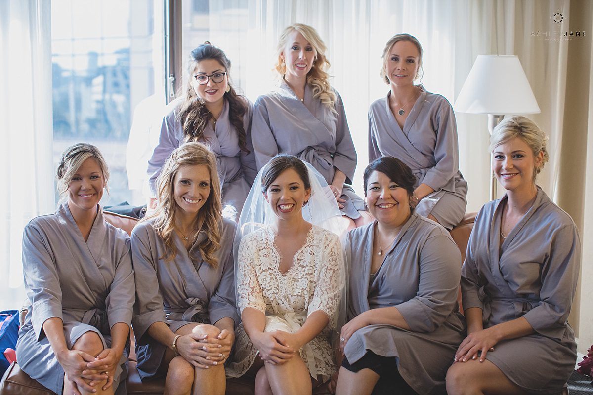 bride her all her bridesmaids getting ready