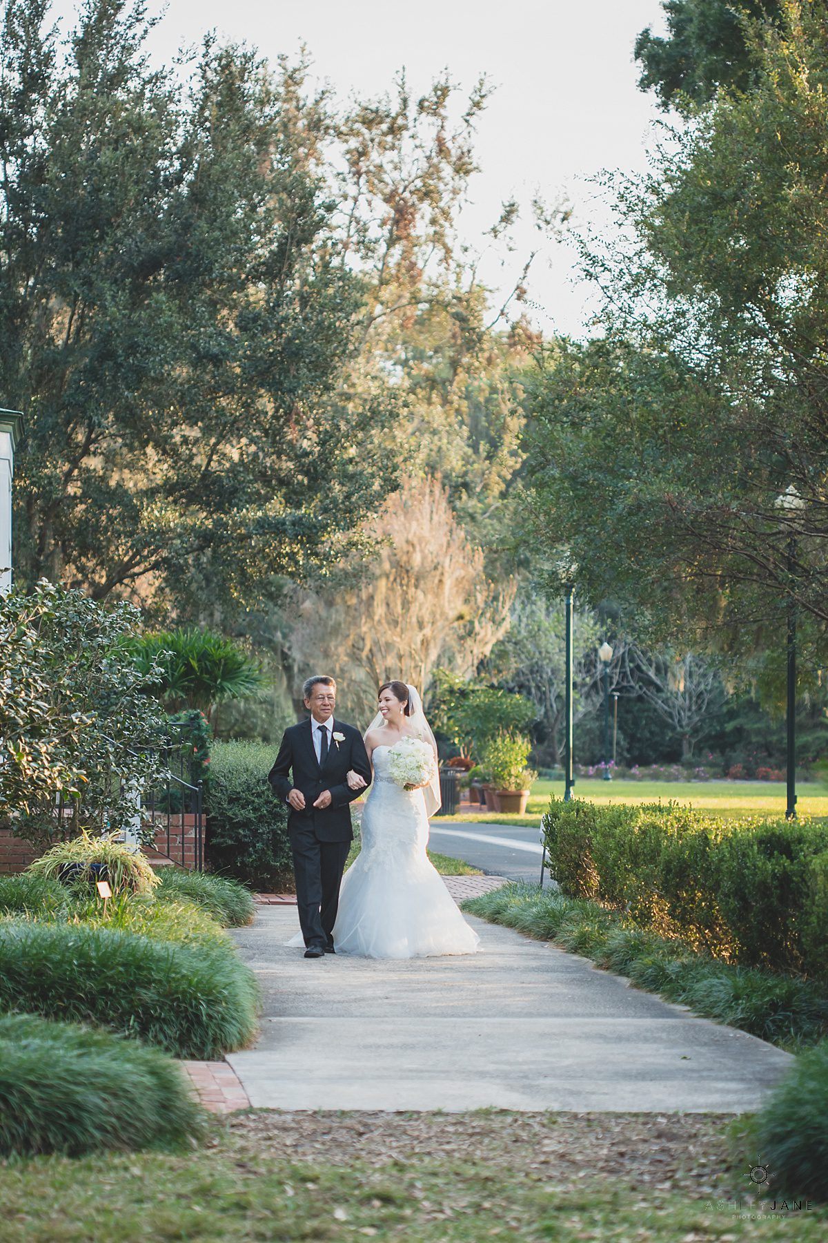 father of the bride walking the bride down the aisle