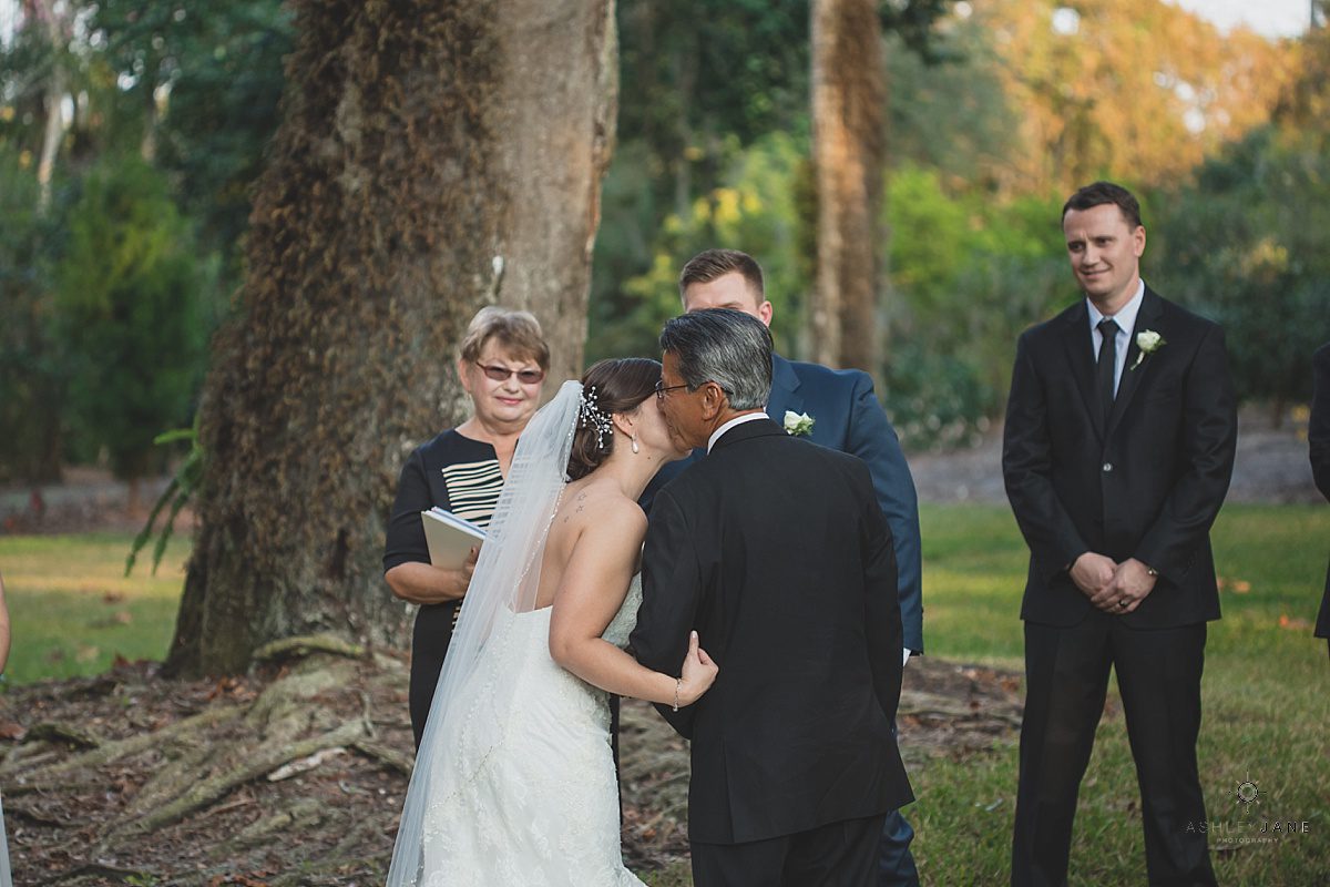 a kiss for the father of the bride at the altar