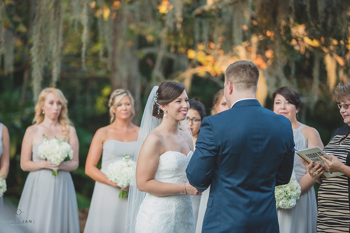 a quick long smile from the bride to the groom on their wedding day