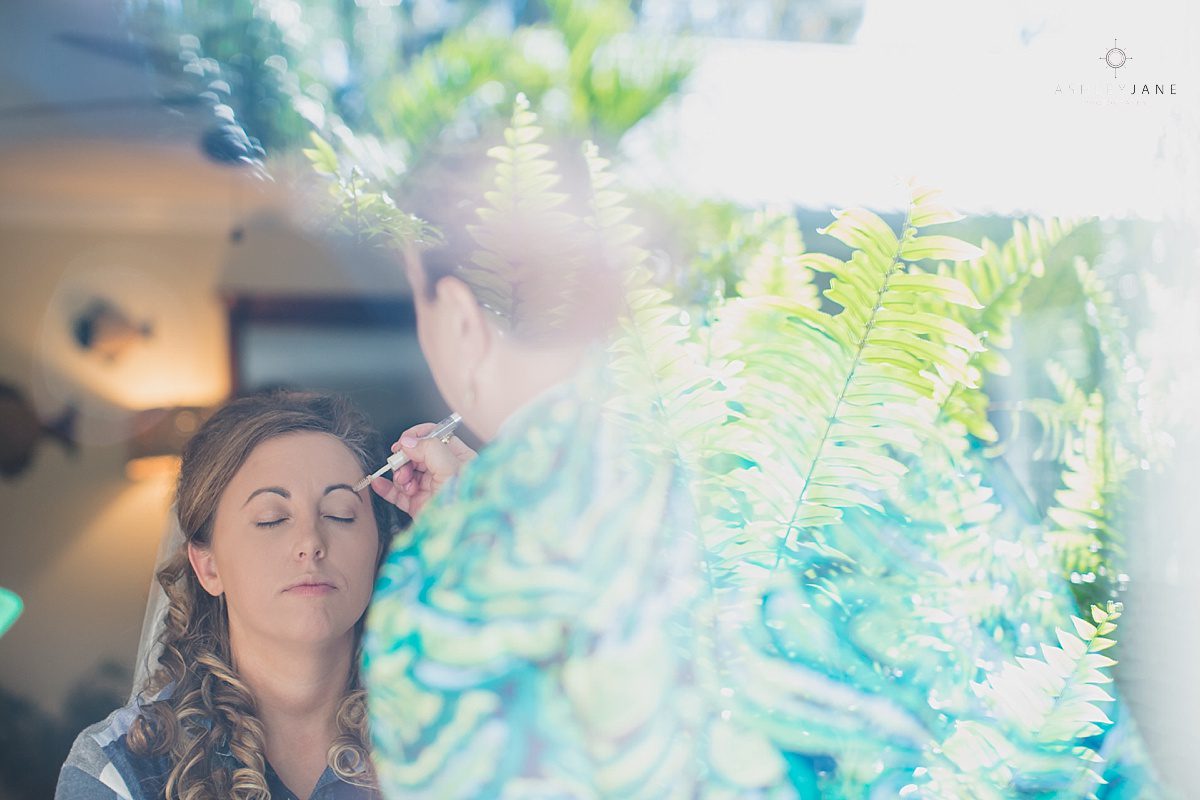 bride getting makeup done