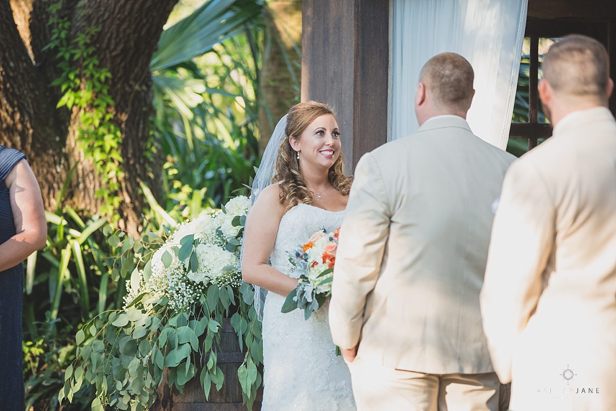 outdoor wedding greenery looking at her groom