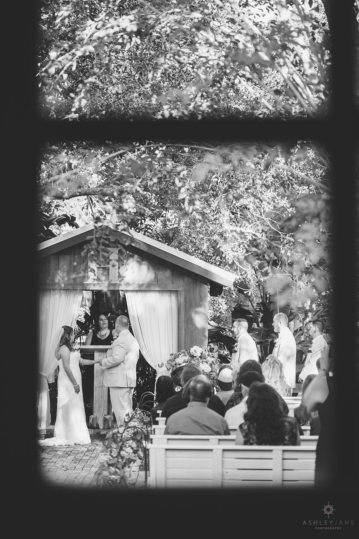 through the window watching bride and groom get married