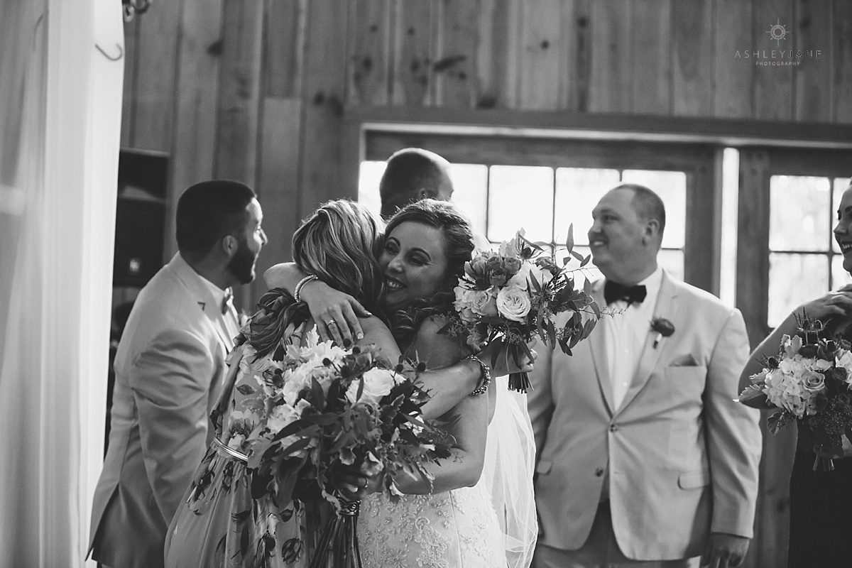 bride and groom celebrating with friends and family after ceremony