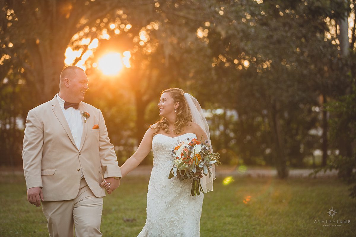 bride and groom outdoors sunset