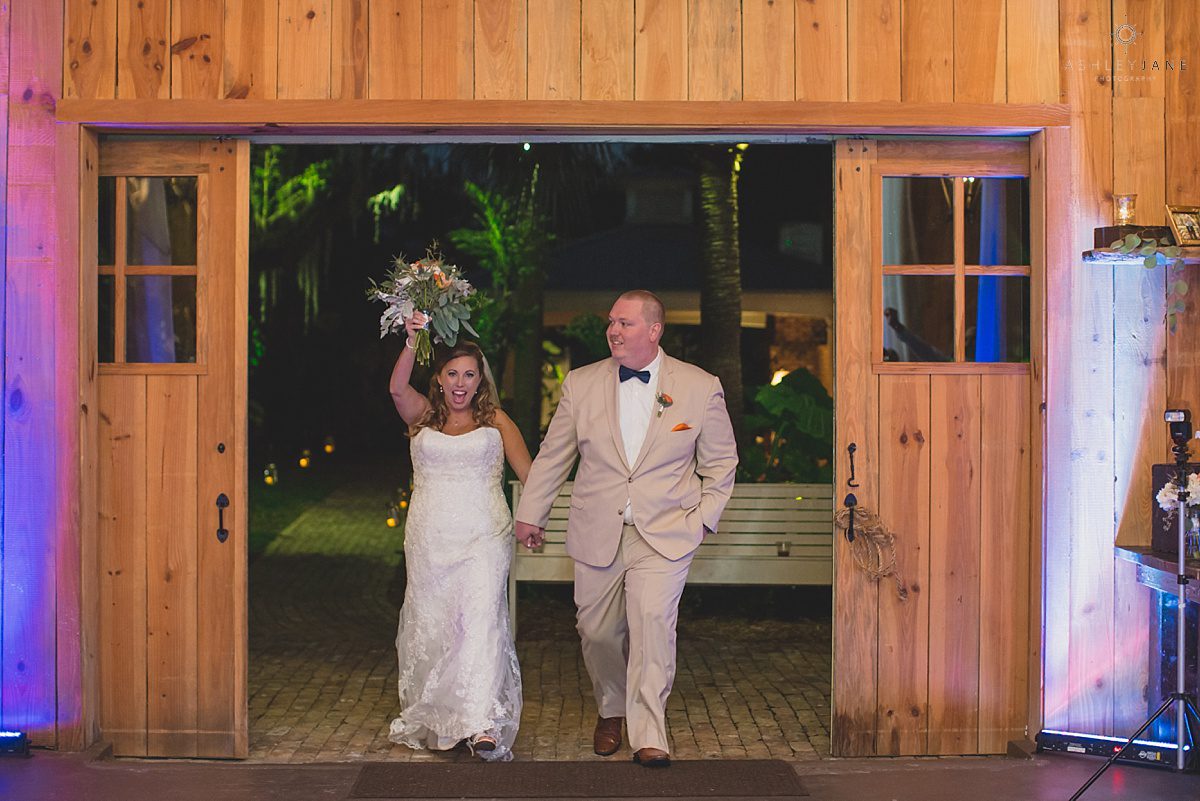 bride and groom enter wedding reception as mr. and mrs.