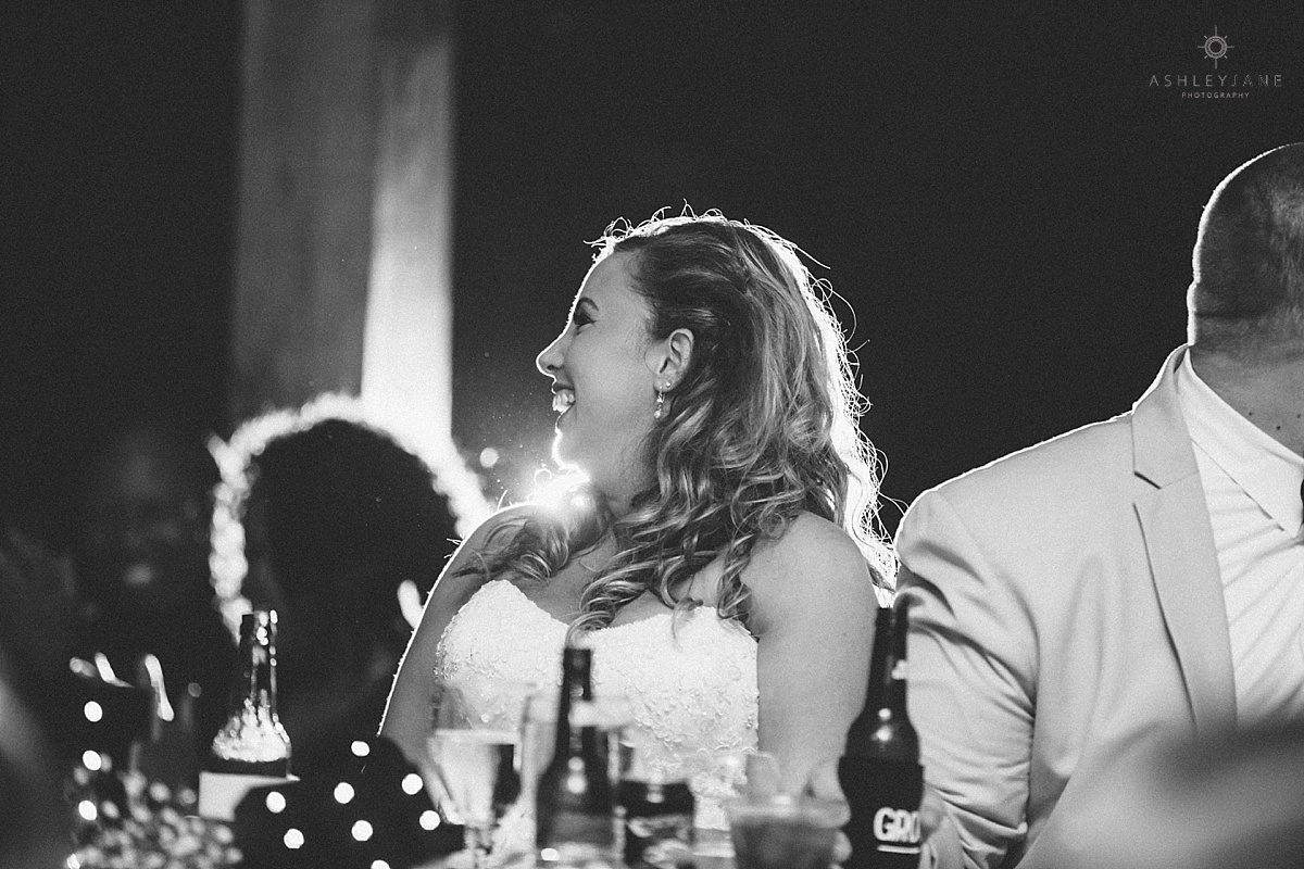 bride laughing during toasts