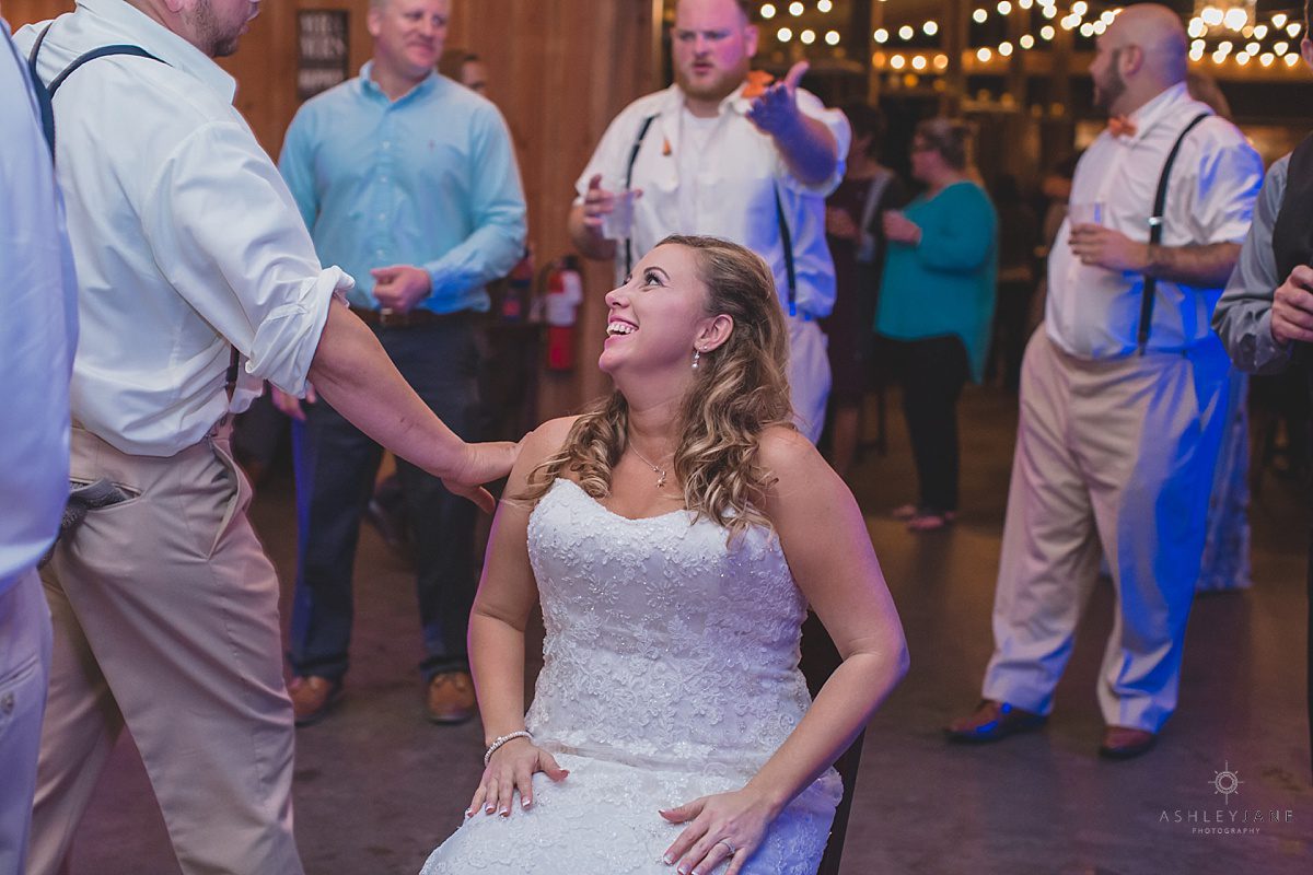 bride waiting to get her garter removed