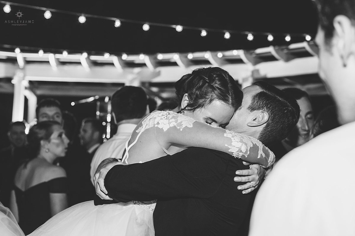 Elegant Rustic Cypress Grove Estate House Wedding | Bride and groom hugging during their wedding reception caught by orlando wedding photographer