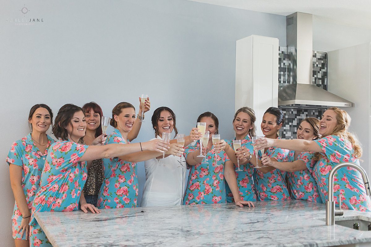 Bride with her bridesmaids in their pj's getting ready 