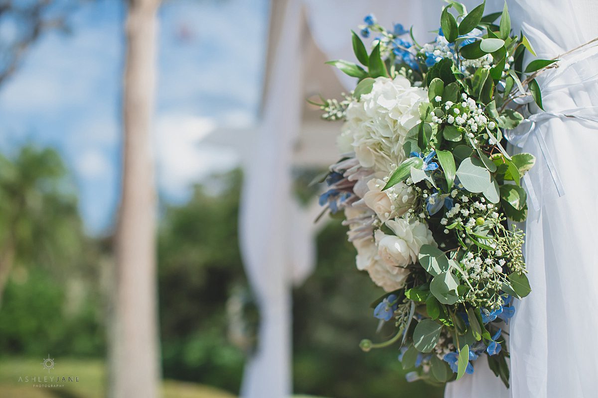 Outdoor ceremony floral arrangements for Southern Estate House Wedding shot by orlando wedding photographer