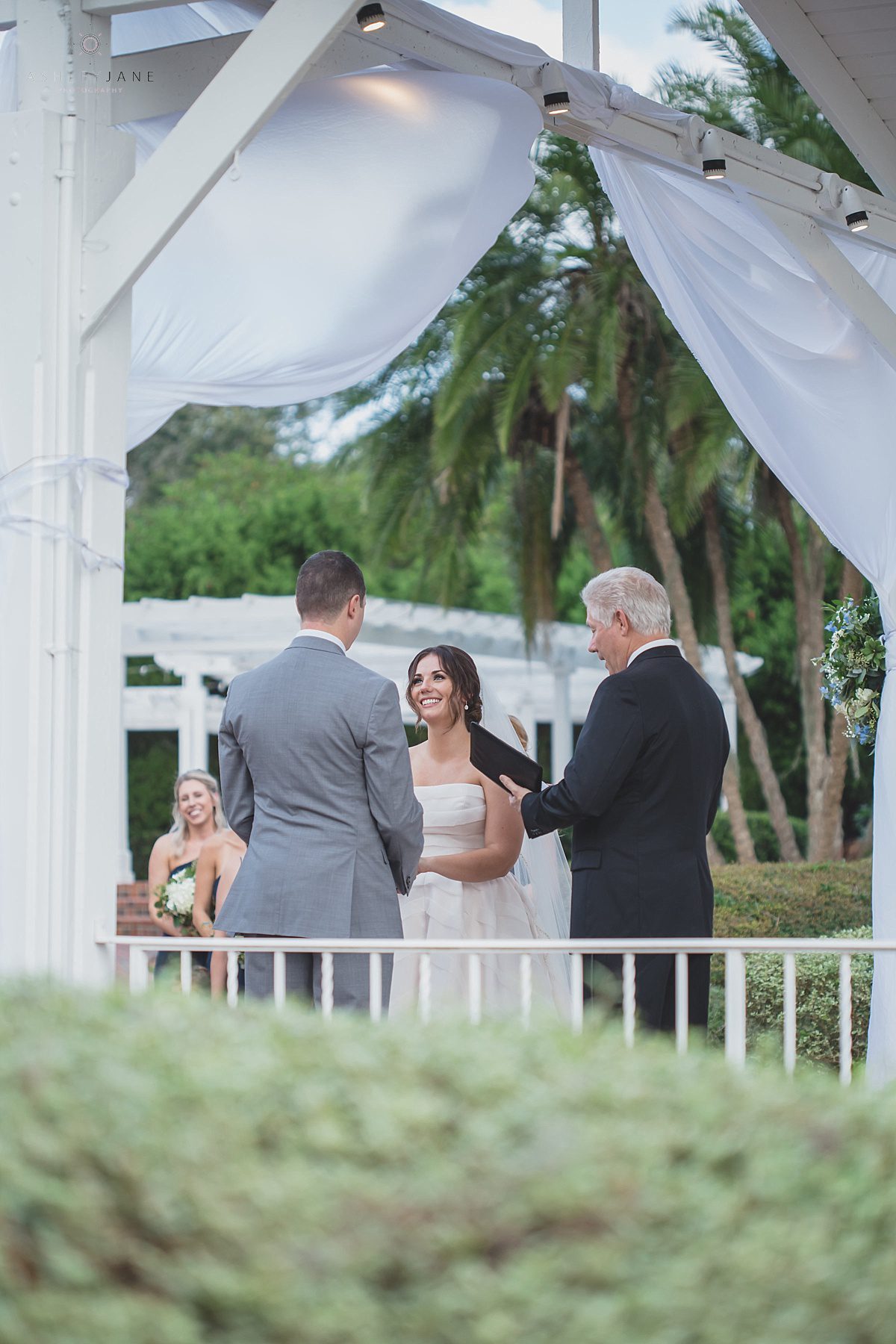 Bride and groom holding hands at the altar of their Southern Estate House Wedding shot by orlando wedding photographer