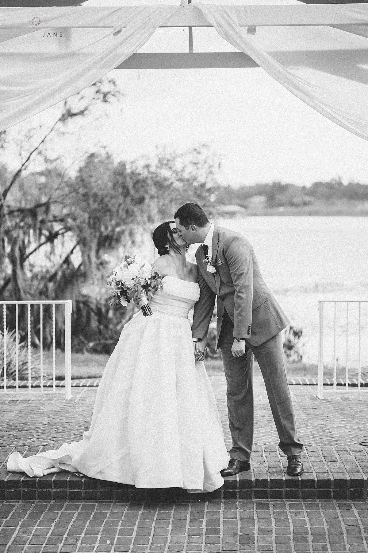 Bride and groom share their first kiss as husband and wife at their Southern Estate House Wedding