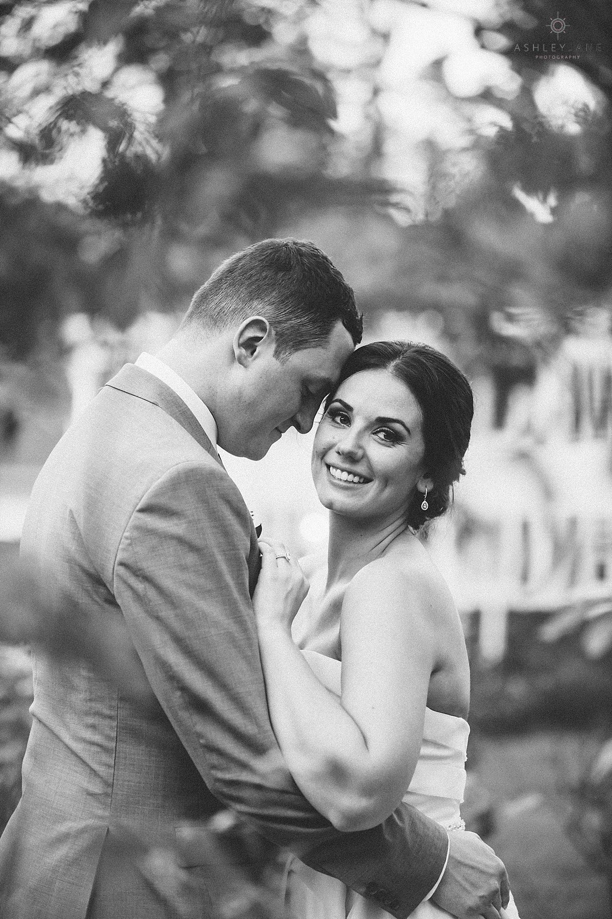 Bride and groom hugging in the garden of their Southern Estate House Wedding shot by orlando wedding photographer