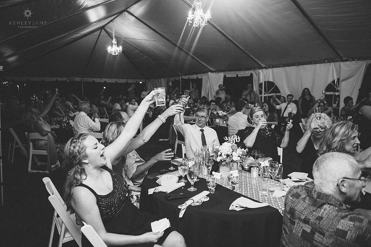 Guests toasting to the bride and groom shot by Orlando Wedding Photographer
