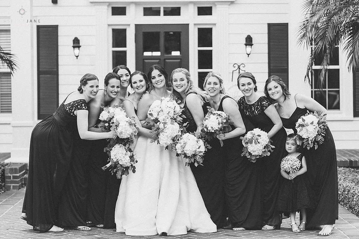 Bridal party and flower girl together in front of Cypress Grove Estate House shot by orlando wedding photographer