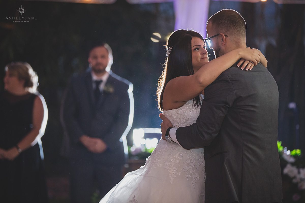 Bride and groom having their first dance at the acrew shot by rolando wedding photographer