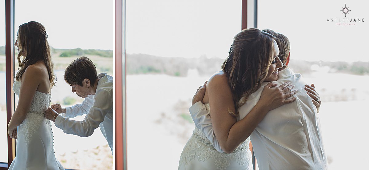 Bride getting buttoned into her gown by her mom caught by orlando wedding photographer