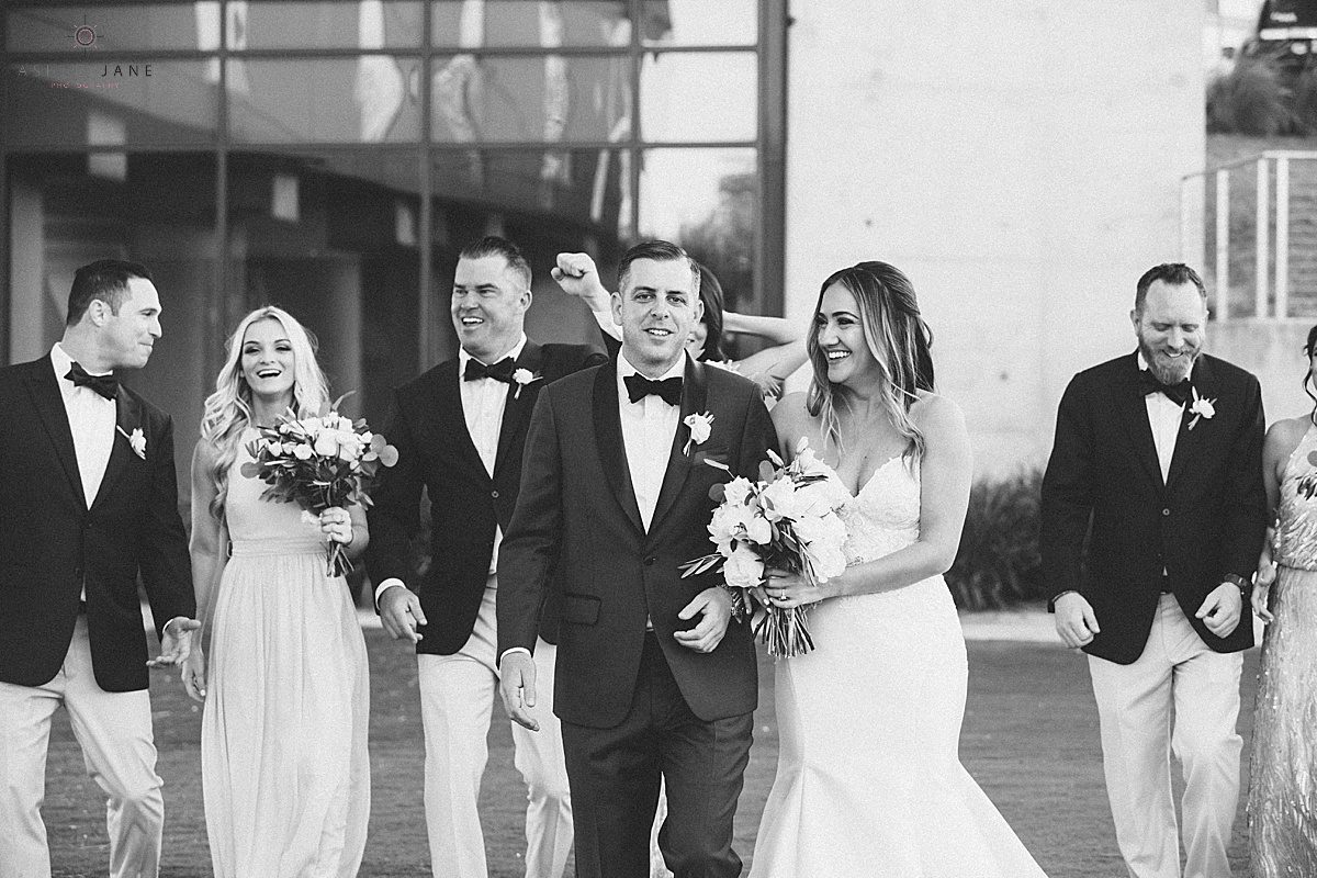 Black and white image of bride and groom with their bridal party shot by orlando wedding photographer