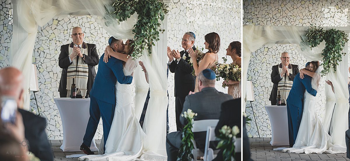 Bride and groom share their first kiss as husband and wife caught by orlando wedding photographer
