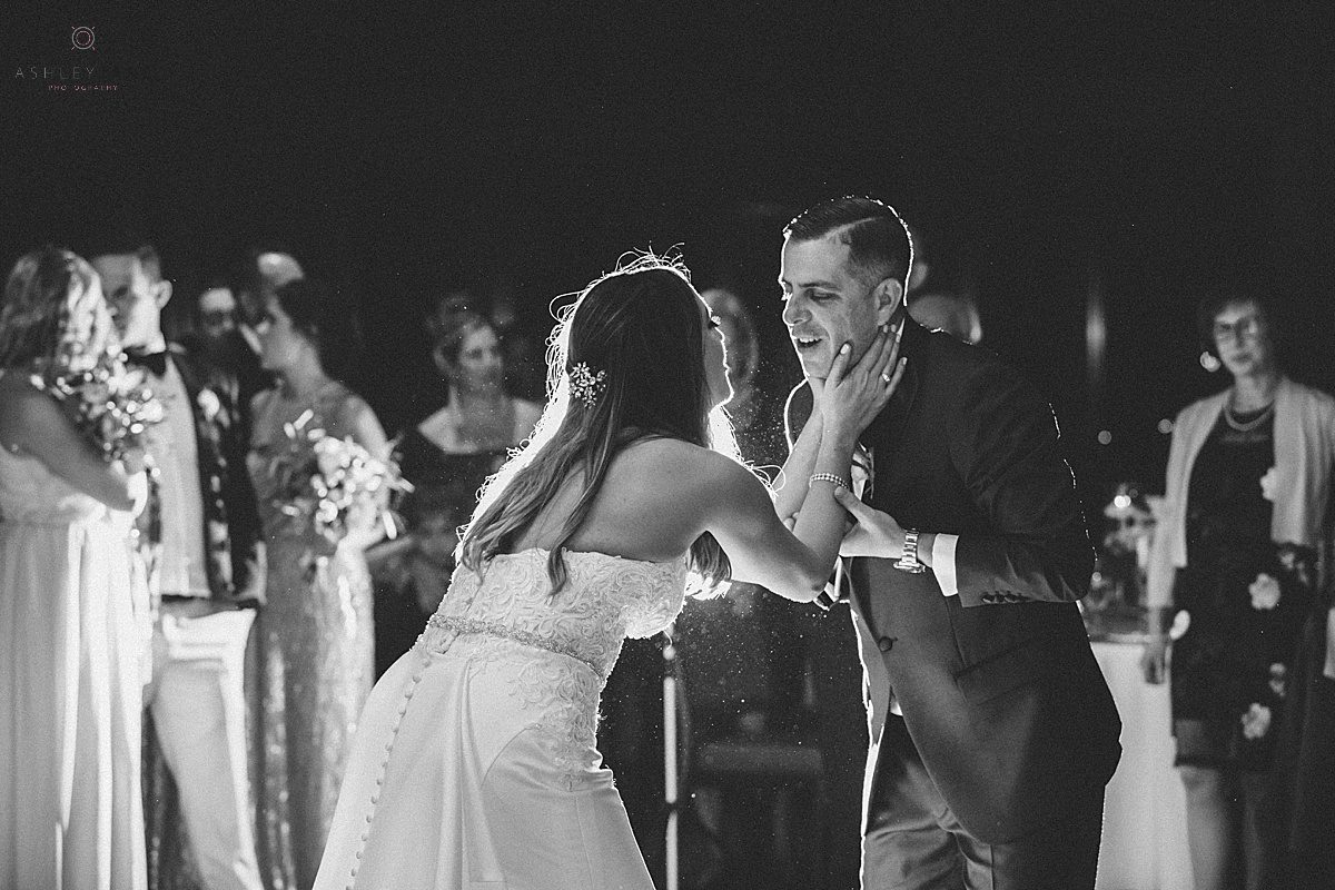 Black and white shot of Bride and groom dancing their first dance at the clubhouse at streamsong red shot by orlando wedding photographer