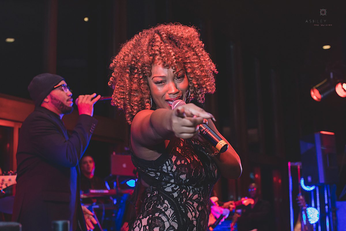 Shot of live band singing caught by orlando wedding photographer