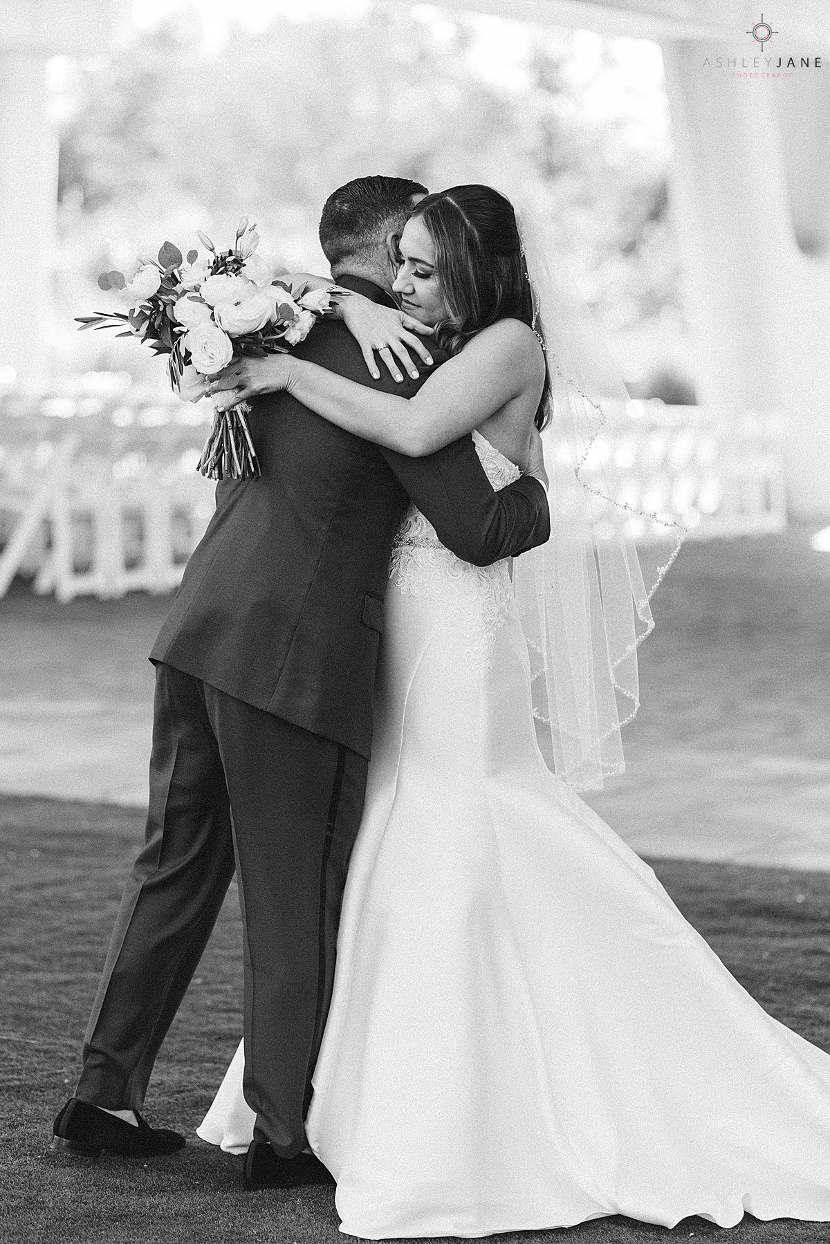 Bride and groom hugging during their first look shot by orlando wedding photographer